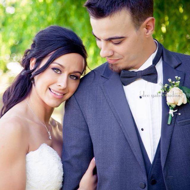 Brunette bride in white wedding dress with groom in navy tux